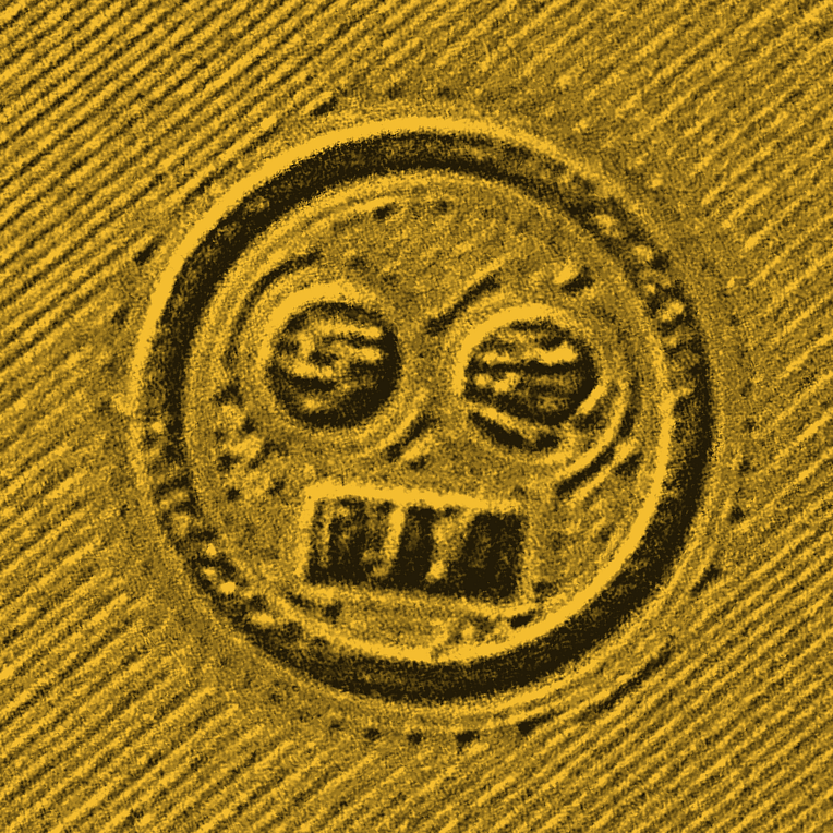 Real debossed SKELZZY skull on the gold cap, photographed on blacktop